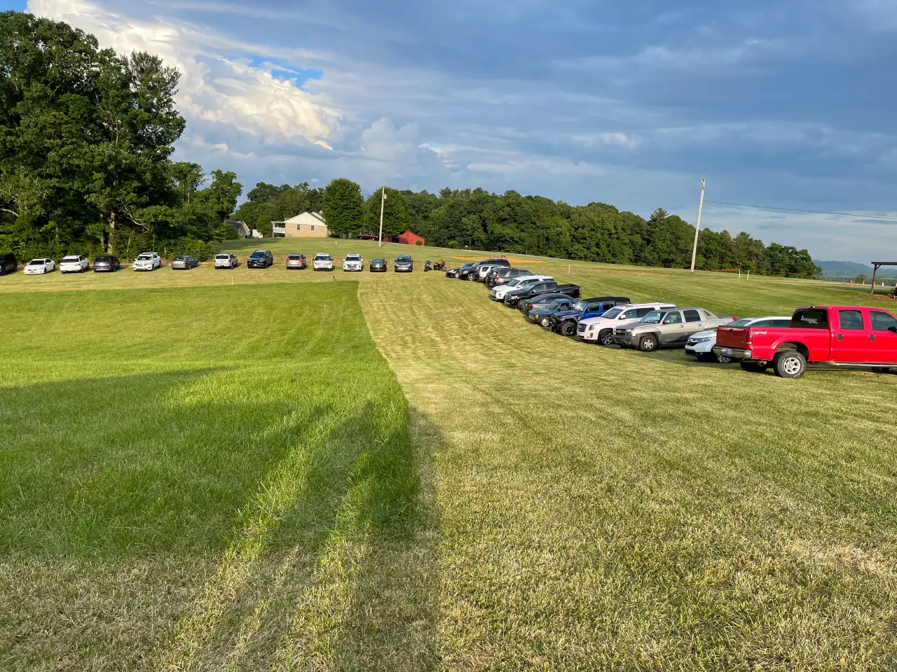 A field with many cars parked on it