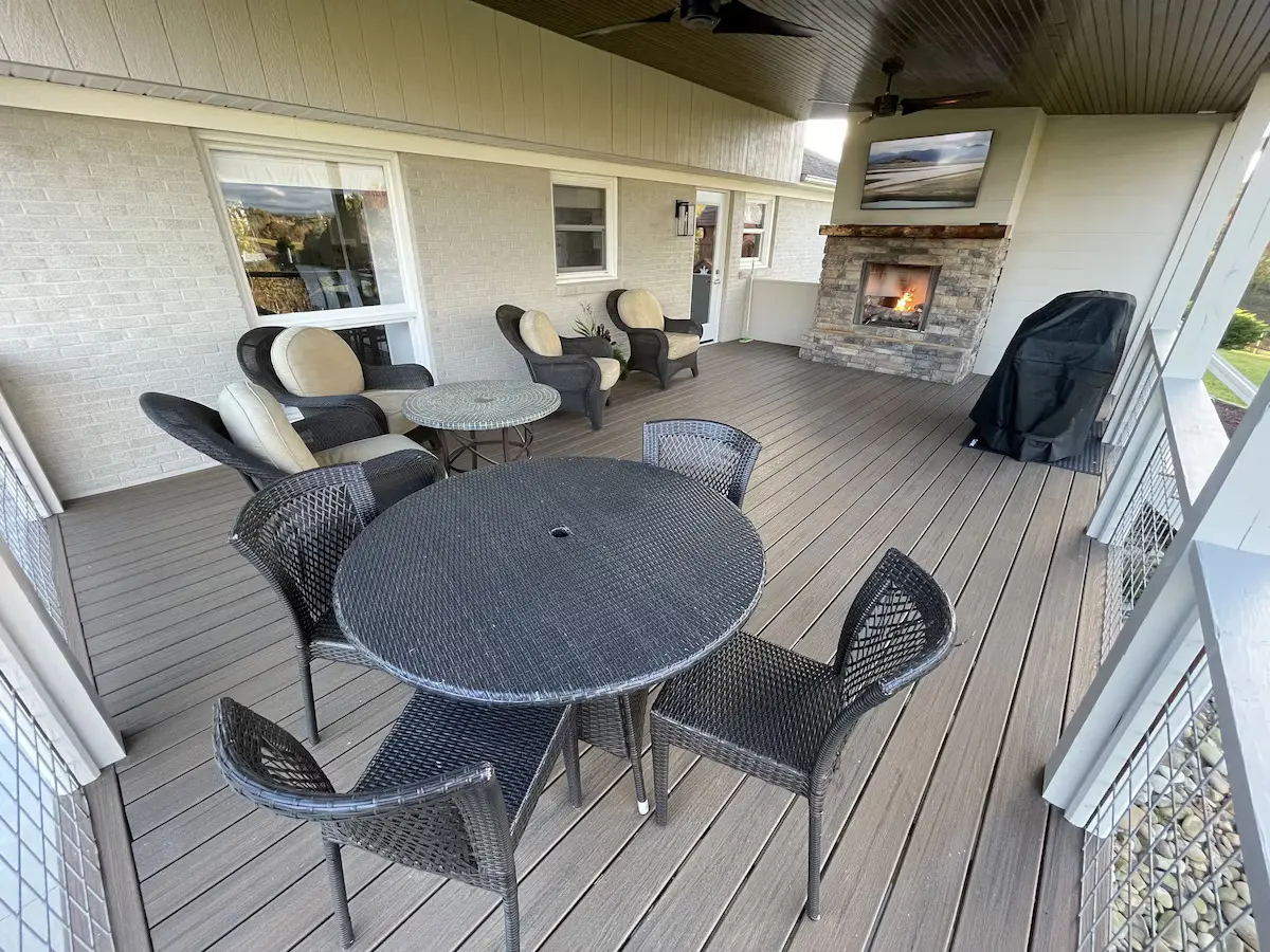 67a11072c58a3_355d1c8d A patio with chairs and tables on the deck