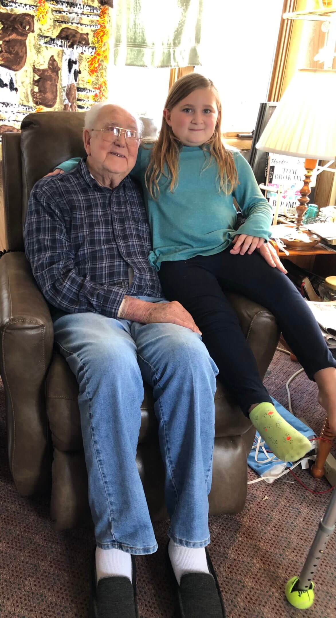 A man and woman sitting on top of a couch.